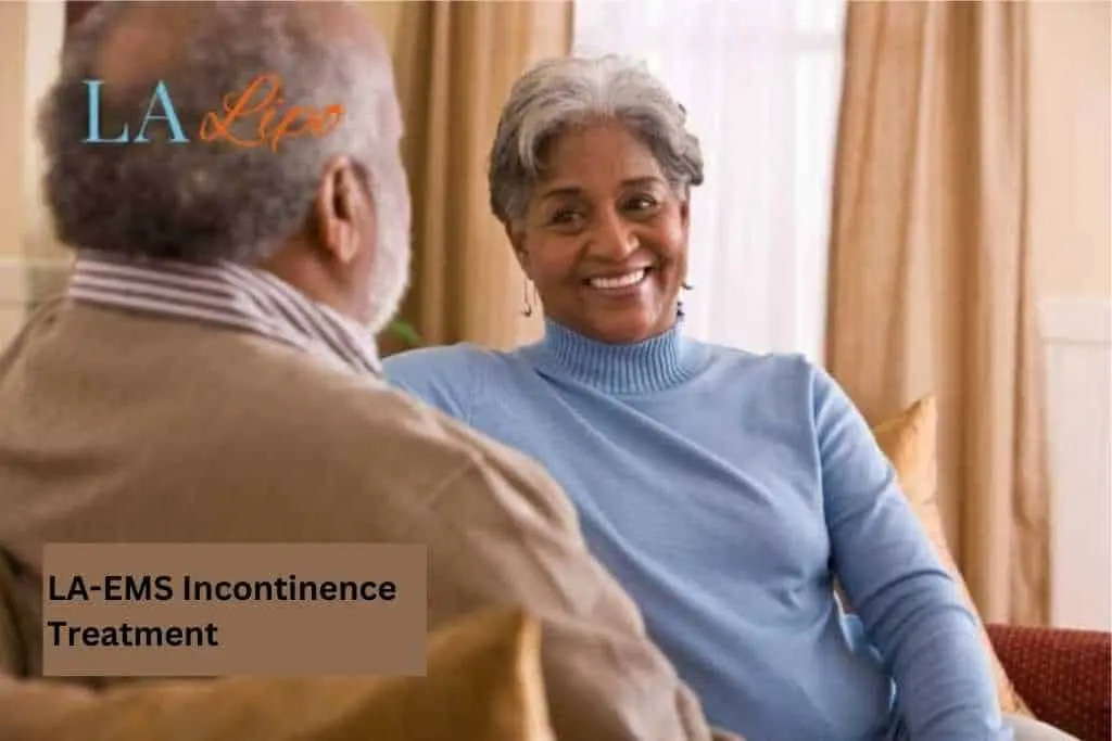 Couple sat smiling at each other - LA-EMS treatment East Sussex