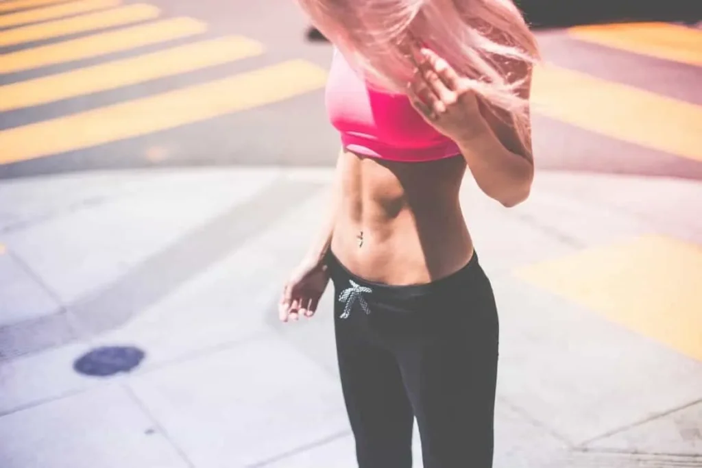 Woman with toned stomach after LA-EMS Body Sculpting Treatment East Sussex